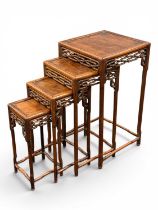 CHINESE ROSEWOOD QUARTETTO NEST OF TABLES, each graduated table having a carved and pierced frieze