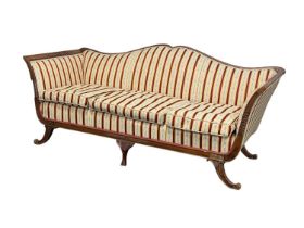 GEORGIAN STYLE MAHOGANY FRAMED SOFA having shaped back, arms and seat upholstered in Regency