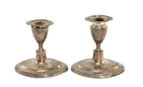 PAIR OF EDWARD VII SILVER CANDLESTICKS, oval form with removable nozzles, loaded bases, Thomas A.