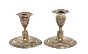 PAIR OF EDWARD VII SILVER CANDLESTICKS, oval form with removable nozzles, loaded bases, Thomas A.