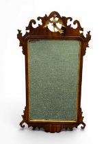 LARGE MAHOGANY FRET FRAMED WALL MIRROR, 19th century, surmount with gilded phoenix Provenance: