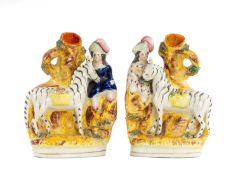 PAIR OF 19TH CENTURY STAFFORDSHIRE FLAT-BACK SPILL VASES, each having a lady in period dress