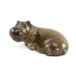 AFRICAN CARVED SERPENTINE SCULPTURE OF A RECUMBENT HIPPO, 7.5 (h) x 14.5cms (l) Provenance: