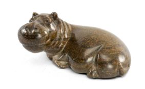 AFRICAN CARVED SERPENTINE SCULPTURE OF A RECUMBENT HIPPO, 7.5 (h) x 14.5cms (l) Provenance: