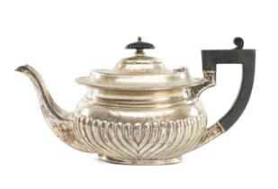 EDWARD VII OVAL SILVER TEAPOT, gadrooned, having ebonised handle and finial, Joseph Rodgers &