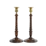 PAIR OF LATE 18TH CENTURY SCOTTISH MAHOGANY CANDLESTICKS, with circular bases, spiralled turned