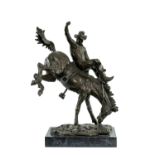 BRONZE SCULPTURE OF A COWBOY ON BUCKING HORSE, in the manner of Frederic Remington, on rectangular