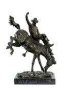 BRONZE SCULPTURE OF A COWBOY ON BUCKING HORSE, in the manner of Frederic Remington, on rectangular