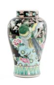CHINESE PORCELAIN FAMILLE NOIR BALUSTER-FORM VASE with enamelled decoration of flowers, exotic