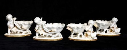 FOUR MOORE BROTHERS PORCELAIN CHERUB & CACTUS BOWLS, with gilded Grecian key design to bases,