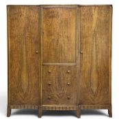 HEAL'S OF LONDON STYLE WALNUT TRIPLE WARDROBE circa 1920s, with central drawer section, modular in