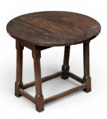 RUSTIC STAINED PINE CIRCULAR FLAP-TOP TABLE, 50 (h) x 60cms (diam.) Provenance: private collection