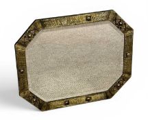 ARTS & CRAFTS BRASS-FRAMED OCTAGONAL WALL MIRROR with relief mounts, bevelled plate, 61 x 76cms