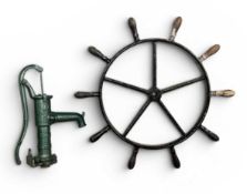 BOAT WHEEL & WATER PUMP, the wheel of heavy metal construction, painted black with ten turned wooden