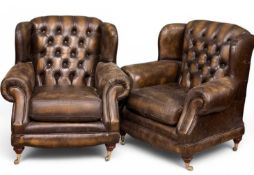 PAIR OF THOMAS LLOYD CHESTERFIELD ARMCHAIRS with button backs, brass castors, retains Thomas Lloyd