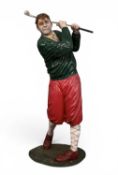 LARGE FLOOR-STANDING FIBREGLASS GOLFING FIGURE wearing plus-fours, in follow-through position,