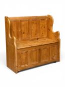 MODERN PINE BOX-SEAT SETTLE with four-panel base and back, hinged top to deep-storage, 91 (h) x