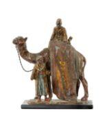 AUSTRIAN COLD PAINTED METAL TABLE LIGHTER, modelled as Arab carpet seller upon a camel, on slate