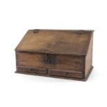 18TH CENTURY OAK TABLETOP BUREAU, angled fall with moulded edge, interior fitted with drawers and