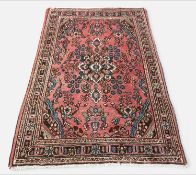 TURKISH USHAK STYLE RUG, central diamond medallion and palmette pendants floral madder field with