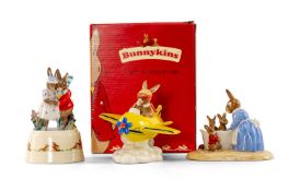 THREE ROYAL DOULTON BUNNYKINS FIGURINES, including Bath Night, Chocs Away, and Winter Waltz (