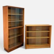 TWO MID-CENTURY TEAK & GLASS BOOKCASES, 144 (h) x 69 (w) x 28cms (d) & 83 (h) x 92 (w) x 24cms (d)
