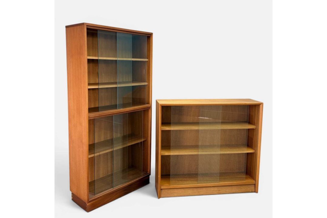 TWO MID-CENTURY TEAK & GLASS BOOKCASES, 144 (h) x 69 (w) x 28cms (d) & 83 (h) x 92 (w) x 24cms (d) - Image 1 of 2