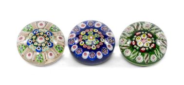 THREE BACCARAT STYLE GLASS PAPERWEIGHTS, probably Scottish, variously decorated with floral and