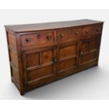 18TH CENTURY OAK DRESSER BASE, pegged construction, three pine-lined frieze drawers, fielded panel