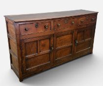 18TH CENTURY OAK DRESSER BASE, pegged construction, three pine-lined frieze drawers, fielded panel