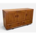 MID-CENTURY ERCOL 468 SIDEBOARD, natural colour, two cupboard doors to left, adjustable wooden shelf
