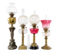 FOUR OIL LAMPS, including one with gilt bronze triple female caryatid column, funnels and shades