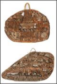 SMALL CARVED STORY BOARD, Papua New Guinea, decorated with a spirit house with tall figural gable