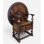 JACOBEAN STYLE CARVED OAK 'TABLE-CHAIR', circular slide & tilt table-top with carved decoration,