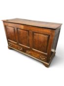 GEORGE III OAK MULE CHEST, circa 1800, with three fielded panel front and fitted with two drawers to