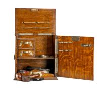 VICTORIAN OAK SMOKER'S CABINET, circa 1890, with Gothic inspired silver-plated mounts, twin carrying
