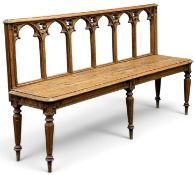 VICTORIAN GOTHIC REVIVAL OAK HALL BENCH, circa 1860-1880, the back with Gothic arches over a solid