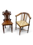 VICTORIAN MAHOGANY HALL CHAIR with carved and pierced shield-shaped back, shaped solid seat,