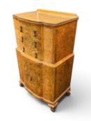 QUALITY BURR WALNUT BOWFRONT TALLBOY in the manner of Epstein, fitted with three upper drawers and