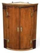 LATE GEORGE III OAK BOWFRONT HANGING CORNER CUPBOARD, 93 (h) x 69 (w) x 44cms (d) Provenance: