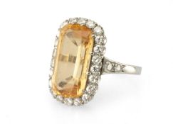 CITRINE & DIAMOND CLUSTER RING, elongated kriss-cut citrine approx. 16 x 8mms, bordered with 22