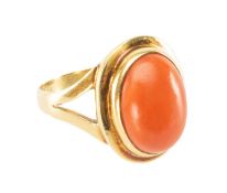 YELLOW METAL OVAL CORAL CABOCHON RING, stamped '750', ring size P 1/2, 6.7g in Brothers Bird of