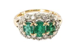 THREE-STONE EMERALD & DIAMOND RING, oval-cut stones of good colour, set within diamond frame, on