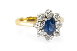 18CT GOLD SAPPHIRE & DIAMOND OVAL CLUSTER RING, the central oval mixed-cut sapphire (6 x 5mms)