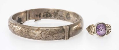 SILVER & AMETHYST DRESS RING in the Celtic style, size M; and a silver engraved hinged bangle,