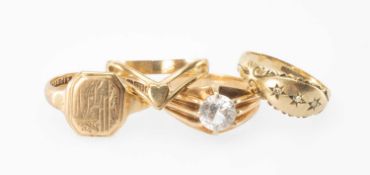 FOUR 9CT GOLD RINGS comprising white stone solitaire, heart design wishbone, signet ring and white