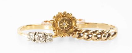 DIAMOND THREE-STONE RING, the small brilliants totalling approx. 0.25ct, later set in 18ct gold,