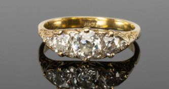 18CT YELLOW GOLD DIAMOND RING set with old-cut stones and diamond accents to spaces, total diamond