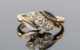 DIAMOND THREE-STONE CROSSOVER RING with three small brilliants, illusion set in platinum with leaf-