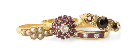 RUBY & DIAMOND CLUSTER RING, centred with a single brilliant-cut diamond of approx. 0.15ct, bordered